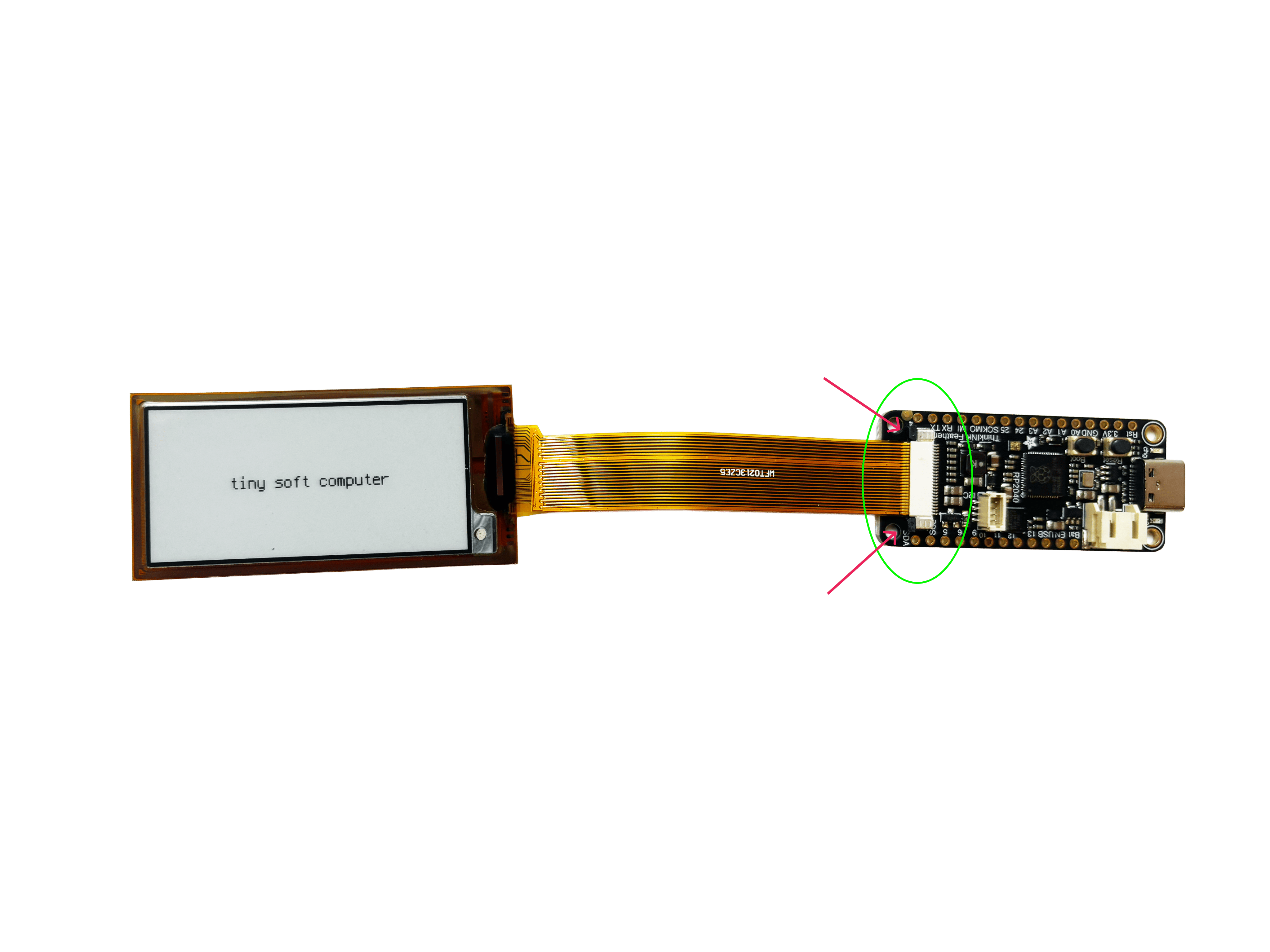 A closer look at the display connector on the Feather board, showing where the ribbon cable seats into the docking port.