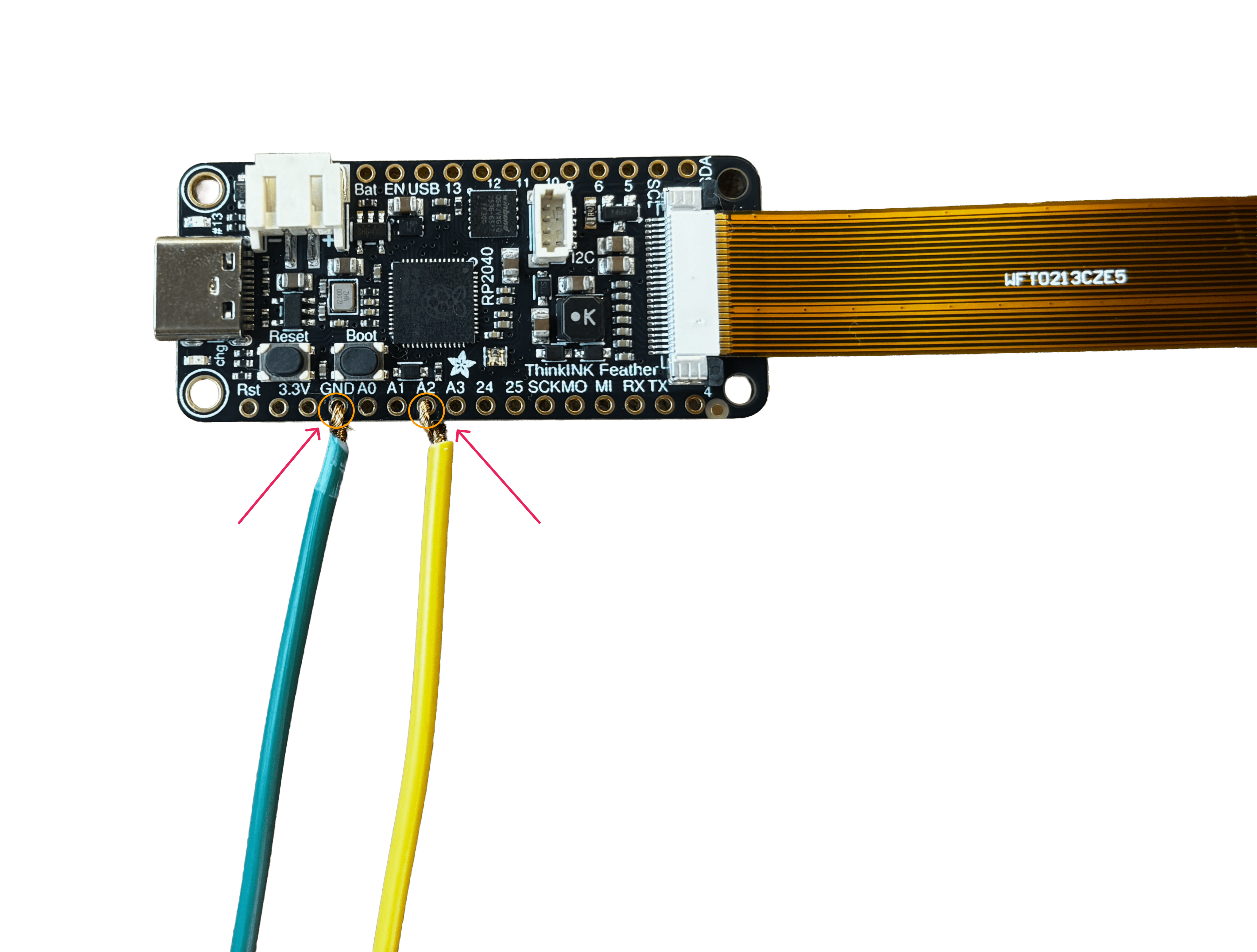 A labeled close-up of the A2 and GND pins on the Feather board, with wires already connected, for reference while wiring.